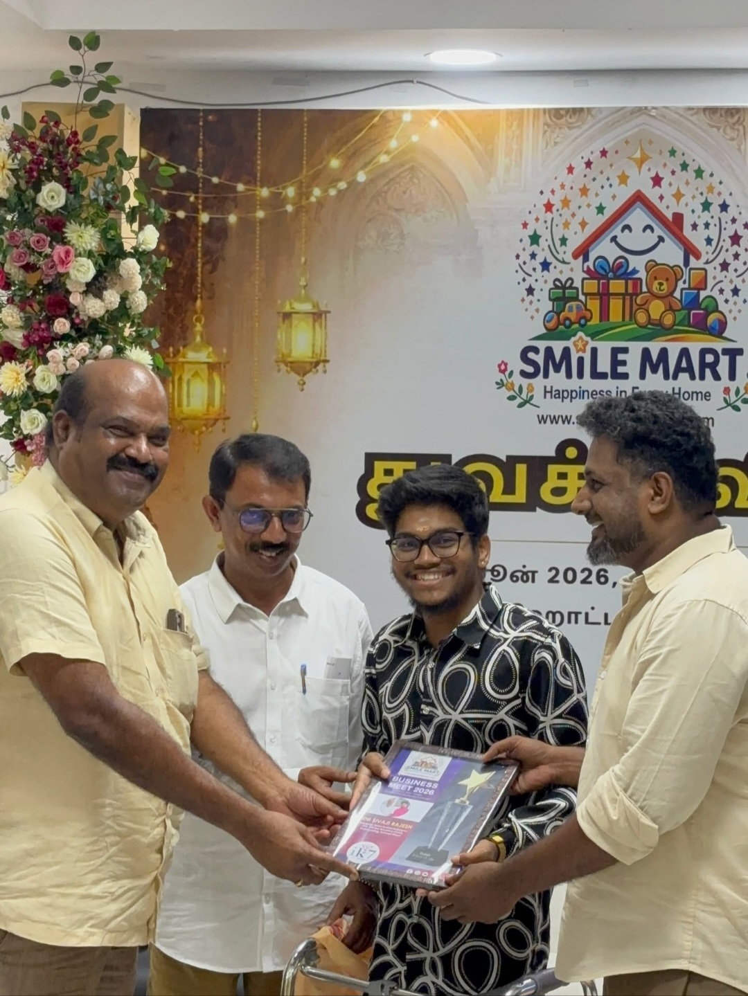 Shield recognition handed to a young entrepreneur at an NNI business meet